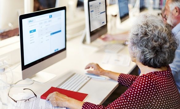 Elderly woman using desktop